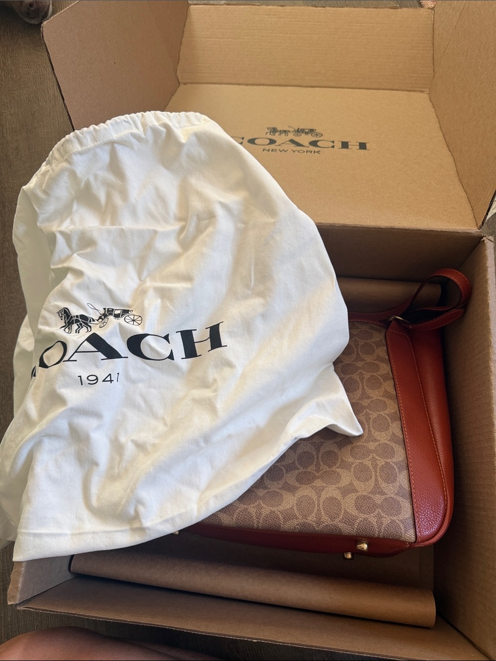 Coach Monogram Canvas Shoulder Bag in Orange.